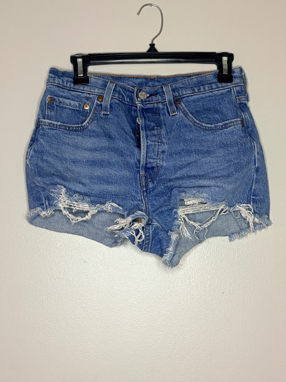 Levi denim shorts with raw hem. Size 27